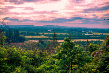 Natural high angle panoramic background With an atmosphere surrounded by mountains and trees, with a blurred wind, cool