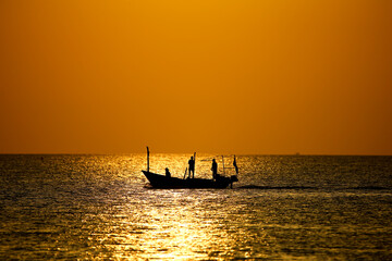 fishing boat at sunset