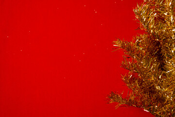 Template for a new year card with a Golden Christmas tree and a red background