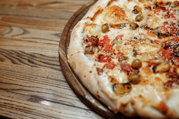 Pizza on wooden table top view. Fast food. Post blog social media. with copy space. Pizza ready to eat