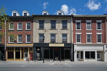 Old fashioned small town main street buildings, with stores on ground floor and apartments above