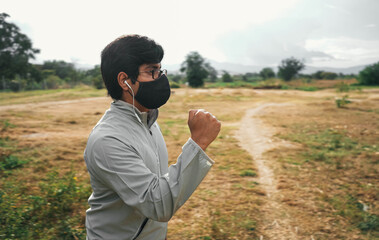 man with mask running in the park