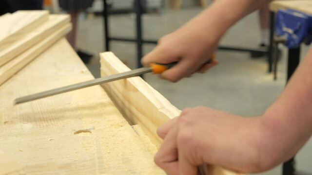 Student Using A Rasping Tool In Woodwork Classroom, CLOSE UP