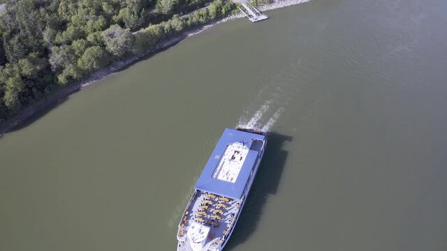 aerial bird eye view over steam boat dinner cruise down river passengers party with private bookings on vintage wheel paddle ship louisiana virgia georgoa straight american nautical entertainment W2-2