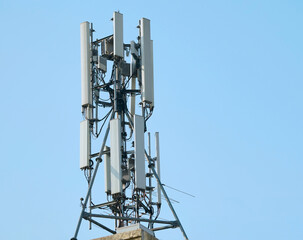 Telecommunication tower of 4G and 5G cellular. Macro Base Station. 5G radio network telecommunication equipment with radio modules and smart antennas mounted on a metal. 
