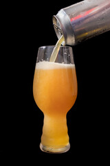 Serving beer from a can into an IPA beer glass