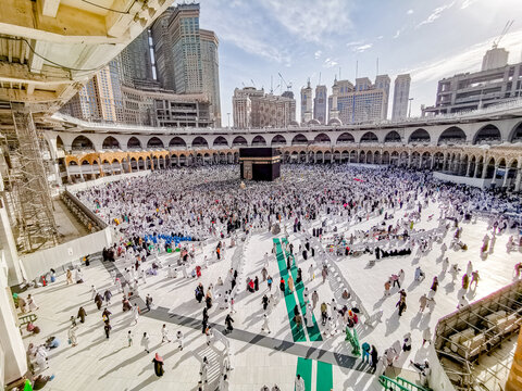 Muslim pilgrims from all around the World revolving around the Kaaba in April 2019 in Mecca Saudi Arabia. Muslim people praying together at the holy place