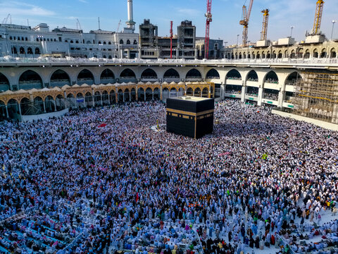 Muslim pilgrims from all around the World revolving around the Kaaba in April 2019 in Mecca Saudi Arabia. Muslim people praying together at the holy place