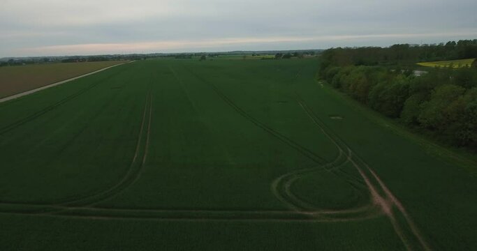 Countryside Field with Tractor Wheel Patterns in South Sweden Sk&aring;ne, &Ouml;sterlen, Tosterup, Aerial High Forward