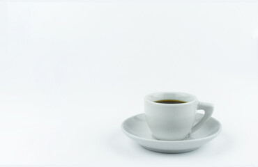 White Cup on a saucer with coffee on a white background