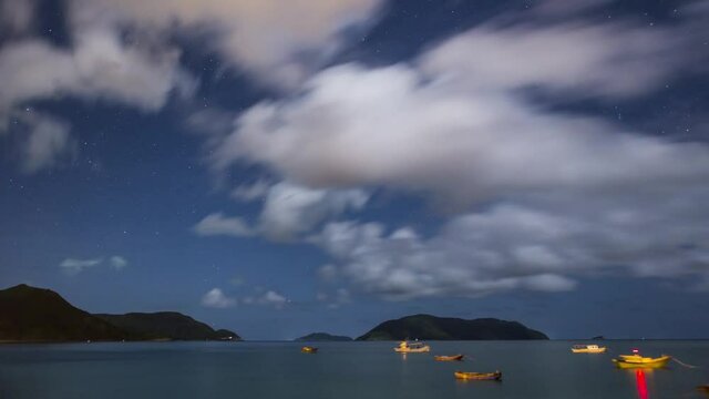 Time lapse sea with beautiful sky and fishing boats
