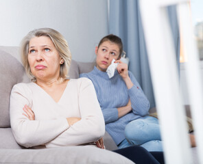 Mature woman and her adult daughter offended at each other after quarrel