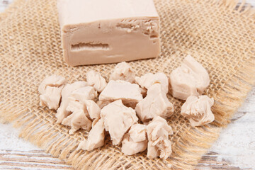 Fresh crumbled yeast for baking different dough or bread