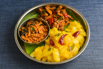 Cooked tapioca with spicy fish curry , Cassava root , Mandioca , Aipim, Kerala special Kappa Puzhukku , Kappa biryani South Indian food meat curry, beef tapioca, India. root vegetable Brazil