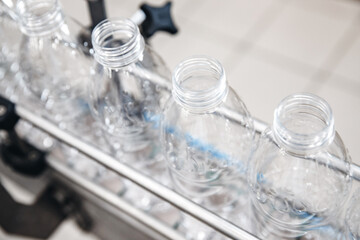 Production of PET plastic bottles on conveyor belt milk and water factory