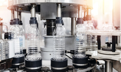Production of PET plastic bottles on conveyor belt milk and water factory
