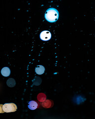 rain drops on the window with bokeh refelctions