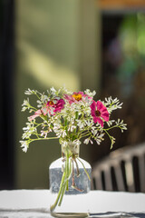 vase of various types of flowers in Vintage Style outdoor Living