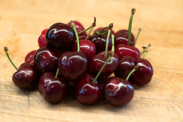 cherries on a wooden cutting board