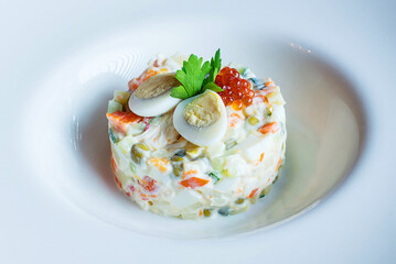 Russian traditional salad Olivier, isolated on white.
