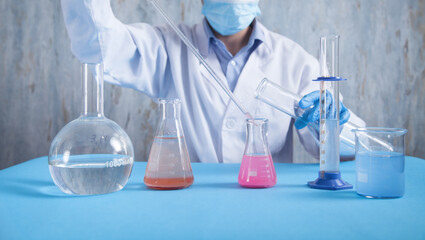 Girl working with flask in a laboratory.