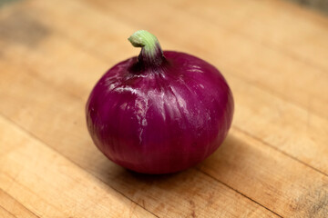 red onion on wooden background cutting board