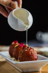Diwali sweets. Gulab jamun with pouring sweet syrup. Indian dessert. Sweet dish, popular festival or wedding food