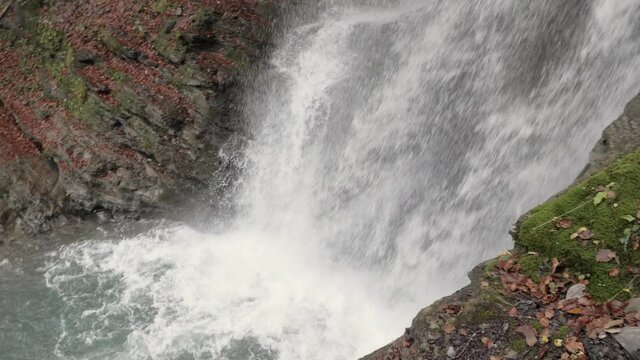 A splendid waterfall in the French Alps, the Cascade de Nyon,  is pouring down water in slow motion.