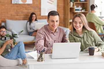 Students with modern devices studying online at home