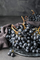 Sweet ripe grapes on table