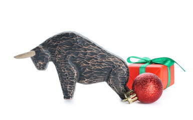 Figurine of bull, gift and New Year decor on white background