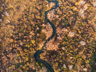 Aerial drone view of autumn landscape with river.