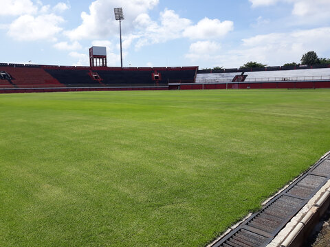 the atmosphere of a quiet football field with green grass