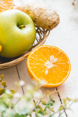 Basket with fresh fruits and ginger