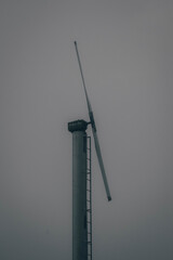 wind generator on a foggy morning