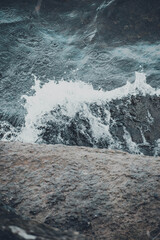 rocks with water slamming in