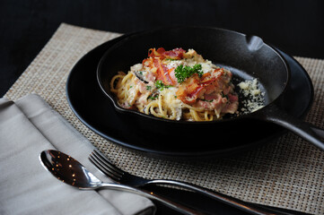 Dried Chili and Bacon Spaghetti on table