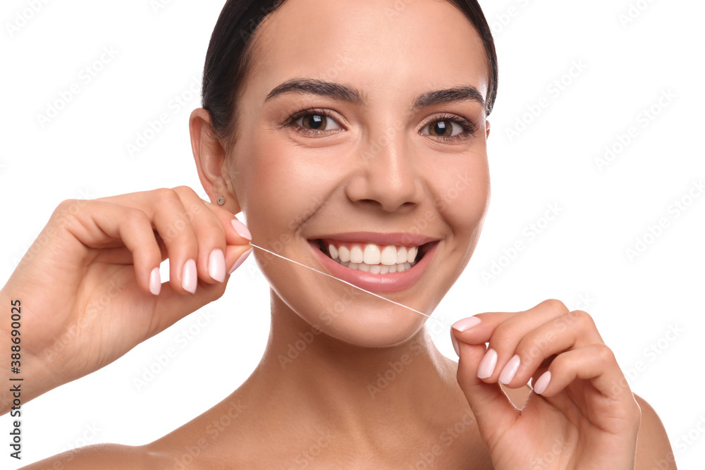 Poster young woman flossing her teeth on white background. cosmetic dentistry