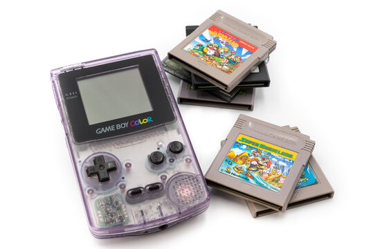 Fukuoka, Japan - june 23, 2019 : the famous nintendo game boy color portable console with some famous game cartridges 