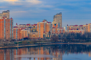 Obraz premium View of Obolon embankment of the Dnieper river and church of the Nativity of Christ in Kiev, Ukraine