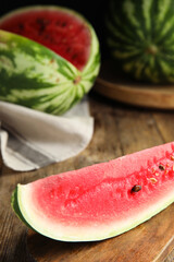 Yummy watermelon slice on wooden table, closeup