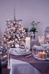 Table setting for celebration Christmas and New Year Holidays. Festive table at home.