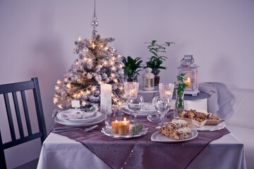 Table setting for celebration Christmas and New Year Holidays. Festive table at home.