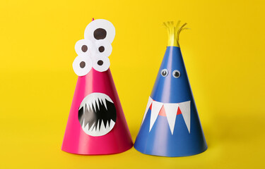 Funny monsters on yellow background. Halloween decoration