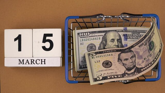 grocery basket with money and calendar. date March 13, World Consumer Rights Day