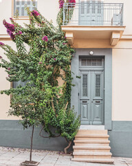 Fototapeta na wymiar classic design house front by the sidewalk, Athens Greece