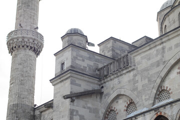 Fototapeta na wymiar Part of the facade of the blue mosque and the minaret.