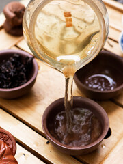 Clay cups with tea, Chinese tea ceremony