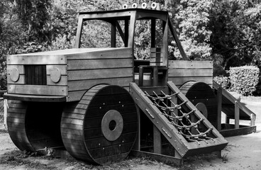 Truck swing for kids in park black and white photo