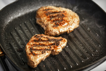 meat with beautiful roast in pan is fried at home